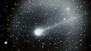 a bright comet streaks through the night sky, leaving a cloudy trail behind it