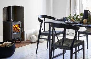 Morso stove in a modern dining room with black dining table and Christmas decorations
