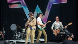Brian Bell, Rivers Cuomo and Scott Shriner of Weezer perform during Download Festival ahead of the band's appearence at Glastonbury 2025