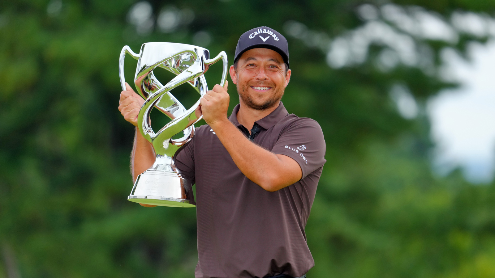 Xander Schauffele holds the Baycurrent Classic trophy