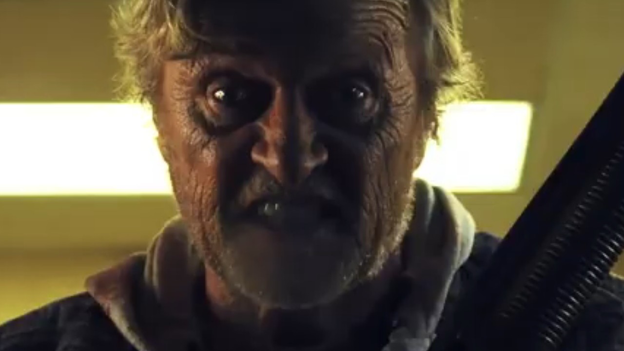 Rutger Hauer with gritted teeth and a shotgun in Hobo With a Shotgun