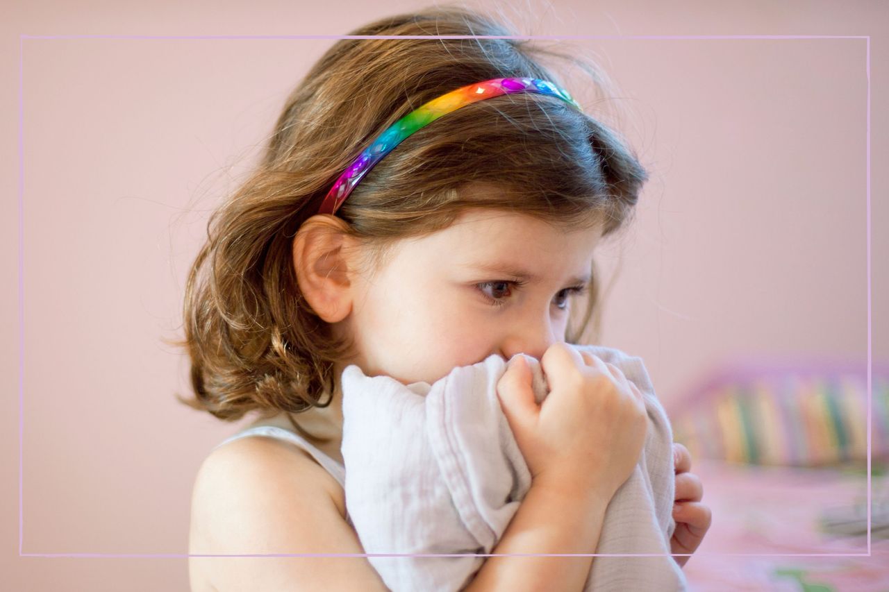 child cuddling blanket axiously