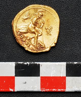 Here, one of the three gold coins found near the bodies in Pompeii.