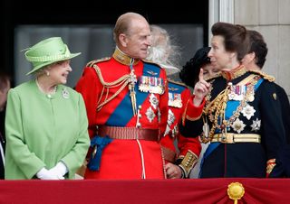 Queen Elizabeth II, Prince Philip, Duke of Edinburgh and Princess Anne, Princess Royal watch a flypast from the balcony of Buckingham Palace