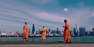 Buddhist monks on their phones in Lo and Behold: Reveries Of The Connected World