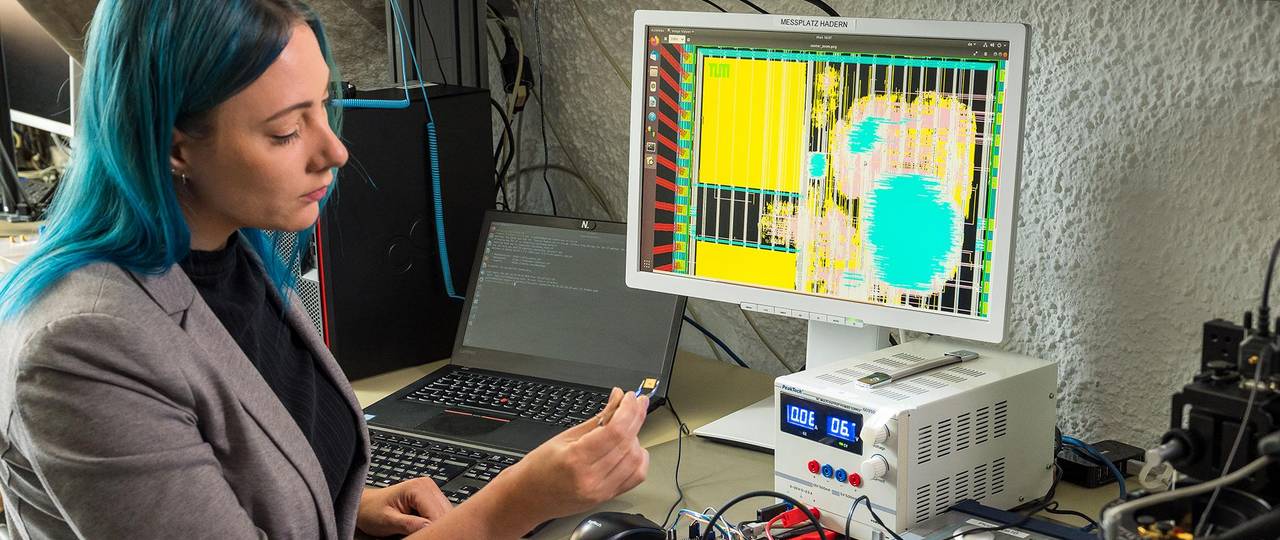 Johanna Baehr, with the Technical University of Munich, holds the RISC-V based post-quantum security chip