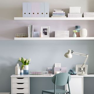 Patel home office with white desk and shelving