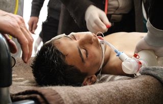 A Syrian victim receives treatment after a chemical attack at a field hospital in Saraqib, Idlib province, northern Syria, on April 4, 2017. Media reports quoting the British war monitor Syrian Observatory for Human Rights state the attack in the rebel-held area killed at least 58 people, including 11 minors, and wounded dozens more.
