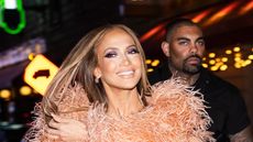 Jennifer Lopez wearing a peach red carpet outfit