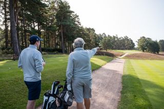 Two golfers deciding on tactics