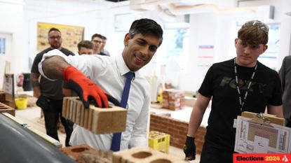 Rishi Sunak lays a brick during a workshop at Cannock College to promote apprenticeships and support from the Tories