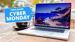 MacBook Pro 16-inch on table with deal tag 
