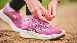 Woman wearing Saucony Ride 17 running shoes