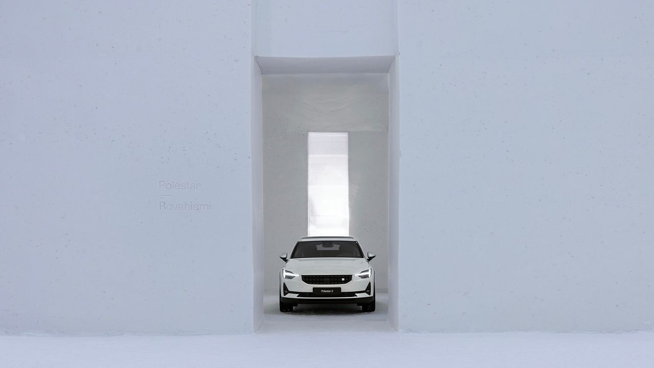 White car inside white Polestar Snow Space, Finland