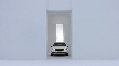 White car inside white Polestar Snow Space, Finland