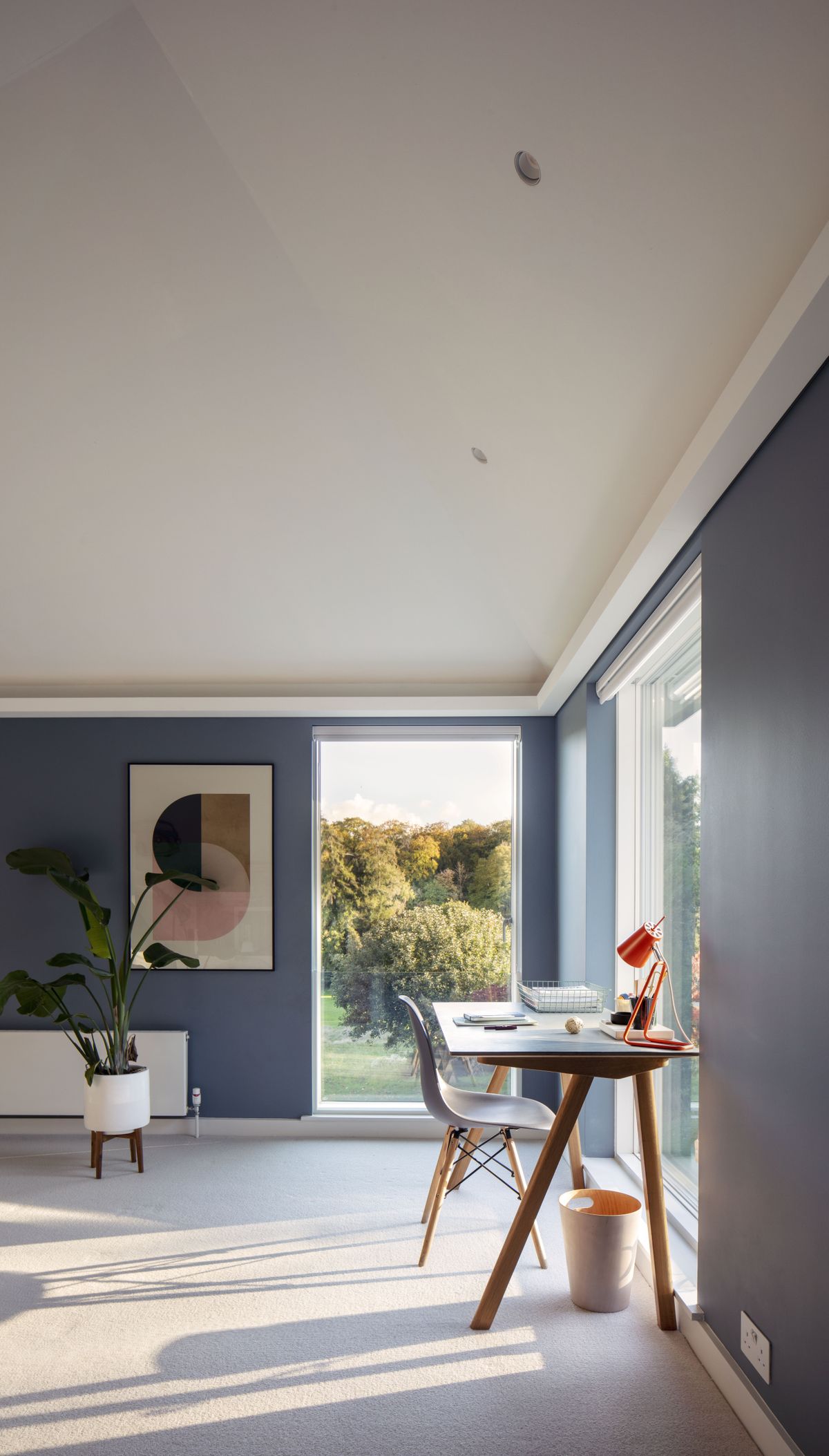 Home office next to floor to ceiling windows