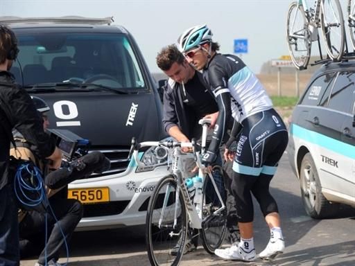 The press descend upon Cancellara as he gets some help with his bike.