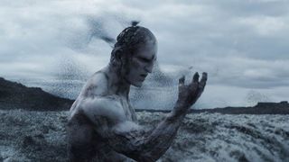 Still from the Alien movie "Prometheus". Here an Engineer, a pale-skin humanoid alien has drank a potion and then disintegrates into black dust.