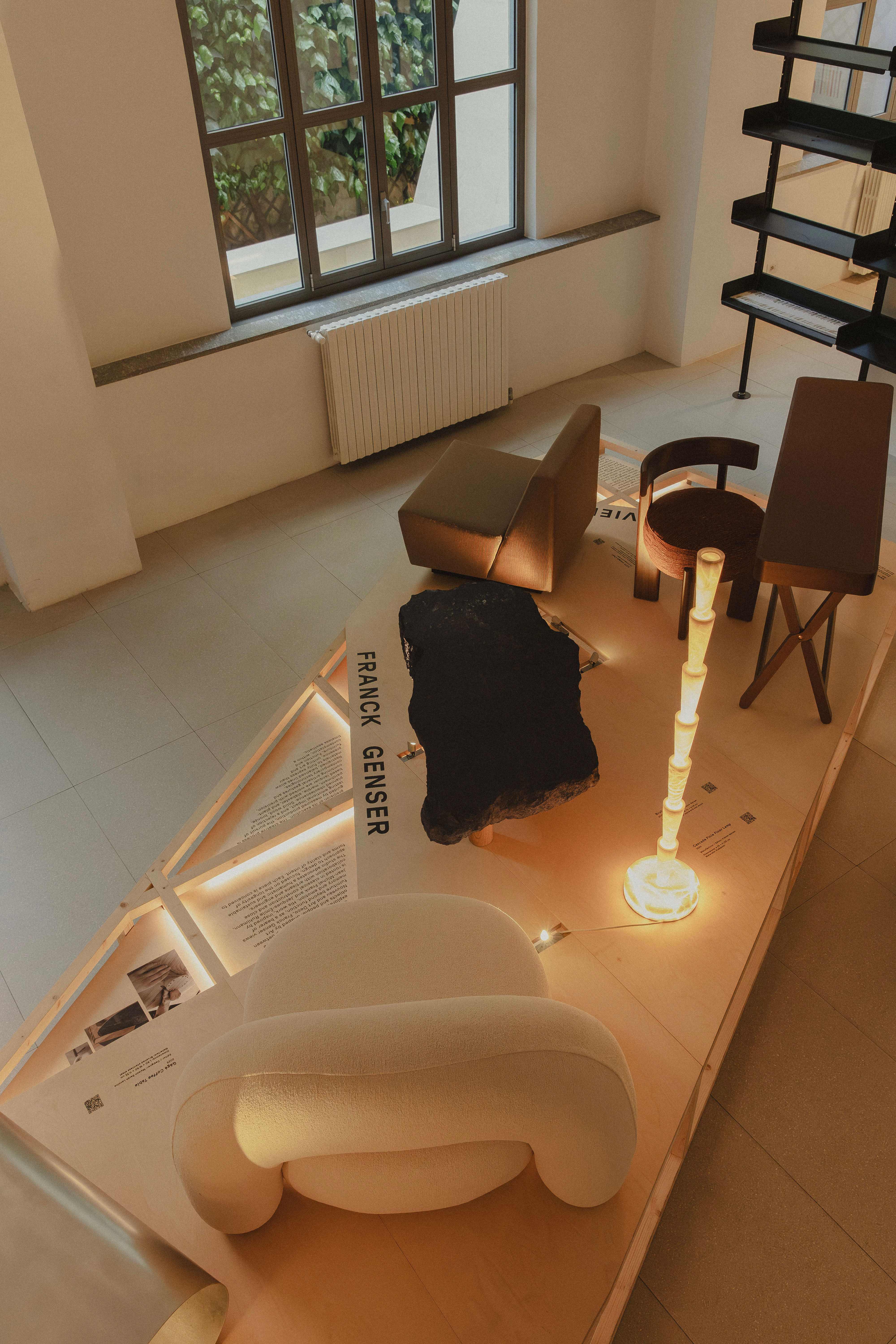 furniture and lighting presented on a wooden platform