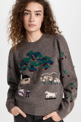 wool sweater with countryside illustration on it