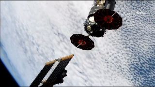 Northrop Grumman's Cygnus NG-12 cargo spacecraft moves away from the International Space Station after ground controllers in Houston used the station's Canadarm2 robotic arm to send it off. At the time of release, the station was flying about 250 miles (400 kilometers) over the South Pacific, just off the west coast of Chile.