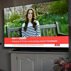 A relative of the photographer watches television, as Catherine, The Princess of Wales announces that she is receiving a preventative course of chemotherapy for cancer on March 22, 2024 in London, England. 