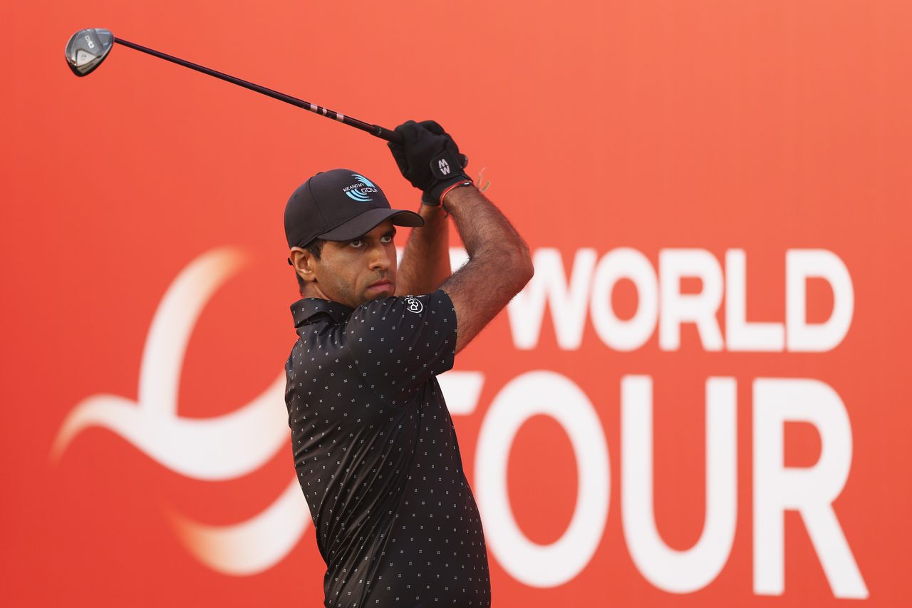 Aaron Rai hits a fairway wood