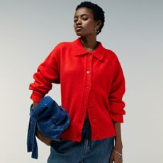Model wearing red collard cardigan and denim tote bag sold at ASOS