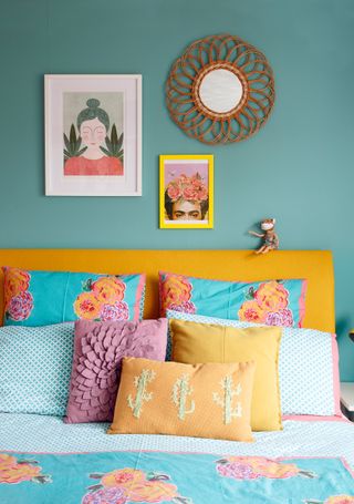 Blue and yellow bedroom with gallery wall and yellow and blue contrasting shades