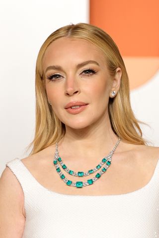 A photo of Lindsay Lohan sporting honeycomb blonde hair at the 2025 Vanity Fair Oscars Party.