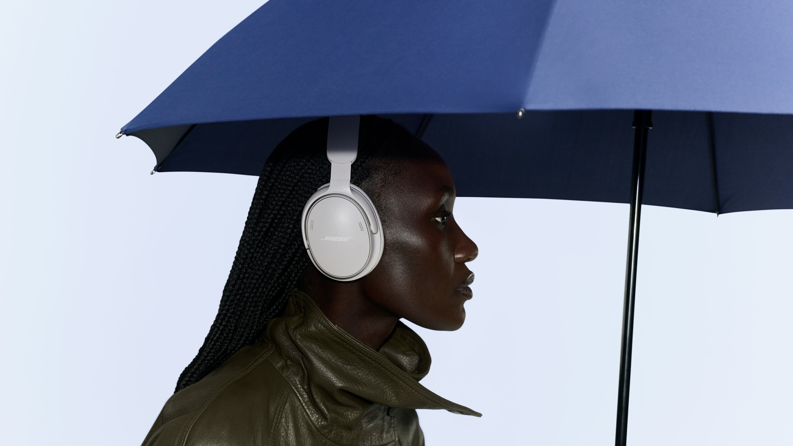 Bose QuietComfort Headphones (2nd Gen) on woman with umbrella, press shot