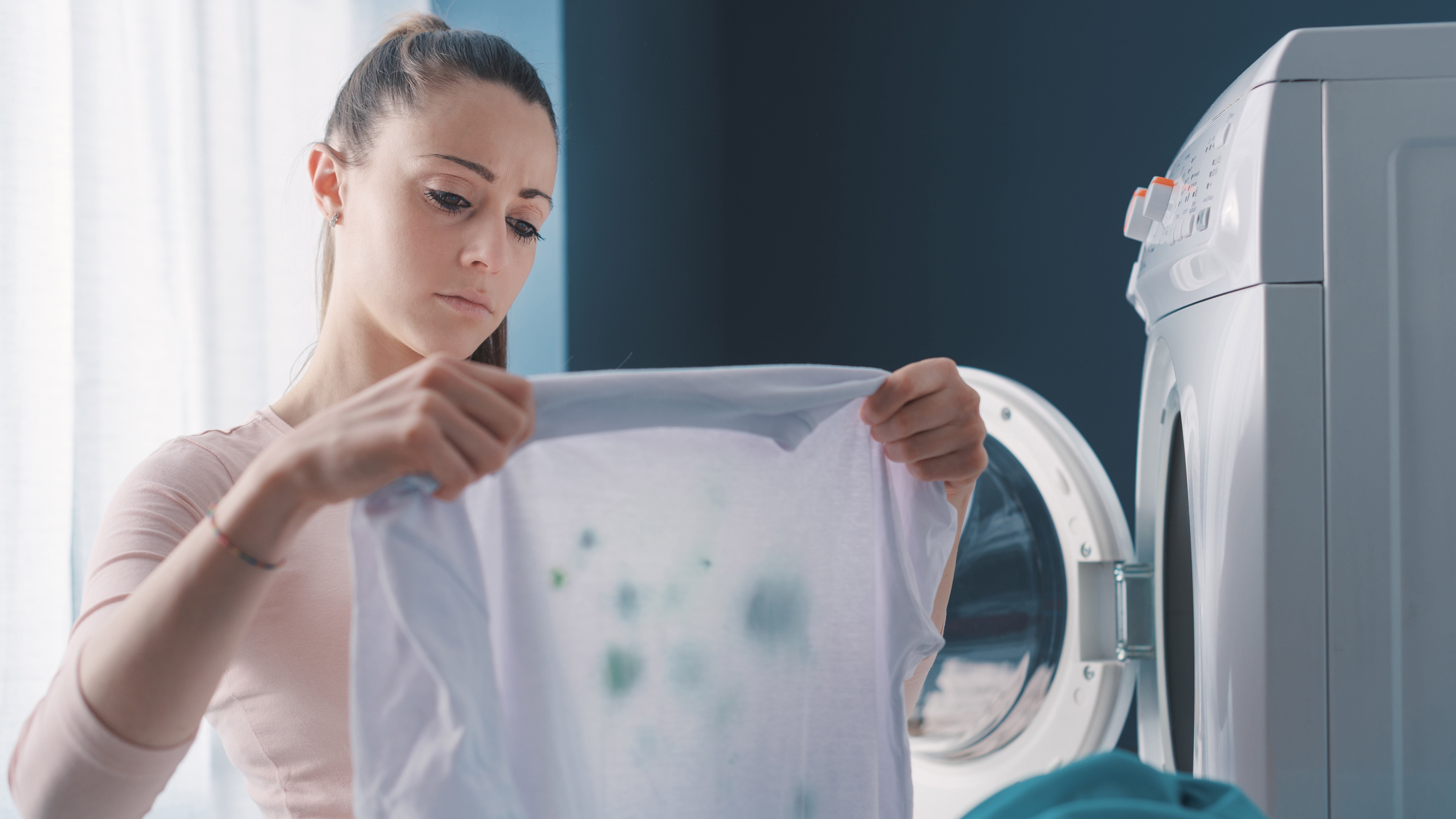 Woman holding stained white garment
