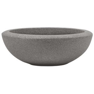 A bowl planter with a concrete finish