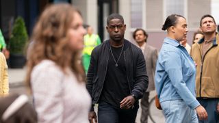 Sterling K. Brown as Agent Collins walking through a crowd in Paradise 