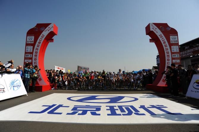 The peloton awaits the start of the first stage at the Tour of Beijing