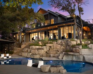 US backyard with pool and boulders