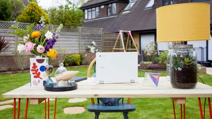 outdoor desk with chair, laptop and accessories in a garden - jeyes fluid