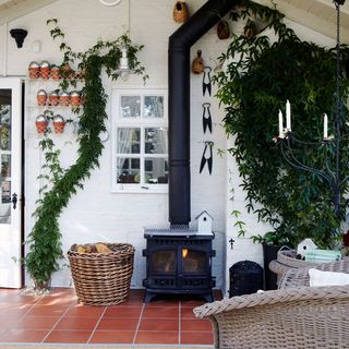 conservatory with fireplace and wooden chair