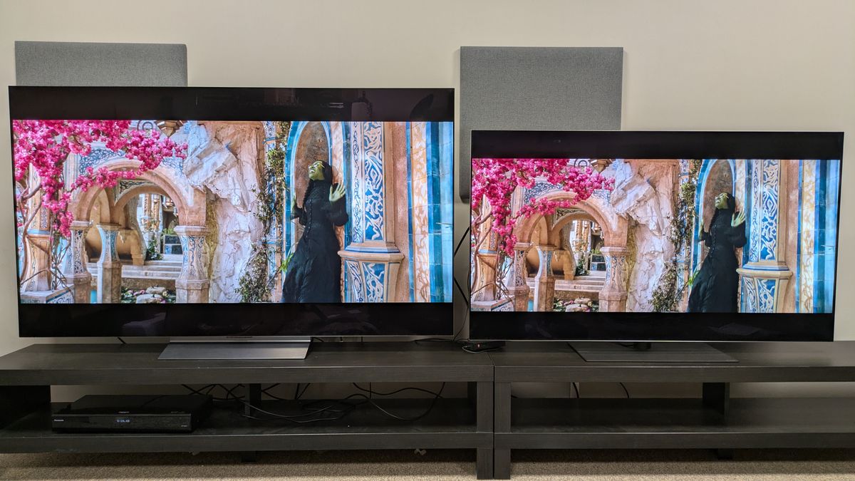 LG C6 (left) and LG G5 (right) with a scene from Wicked, with Elphaba standing under a tree. The G5 has more vibrant, striking colors, particularly of the pink flowers in the tree