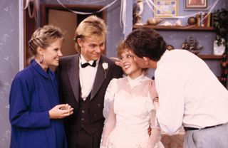 Neighbours characters Charlene and Scott on their wedding day