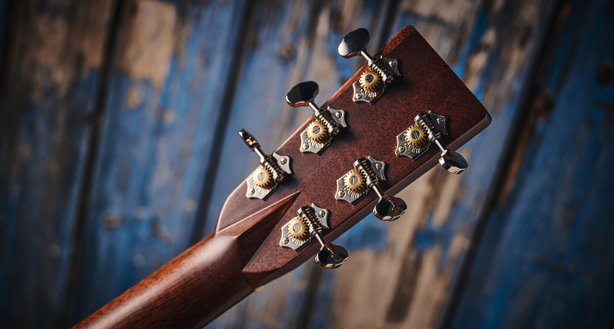 Martin OM-28E with L.R. Baggs Anthem is a stunning update on a classic acoustic, with top-class electronics. Here it is photographed in close-up and against a door with a distressed blue paint-job.