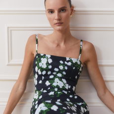 Woman wearing floral dress from Goop