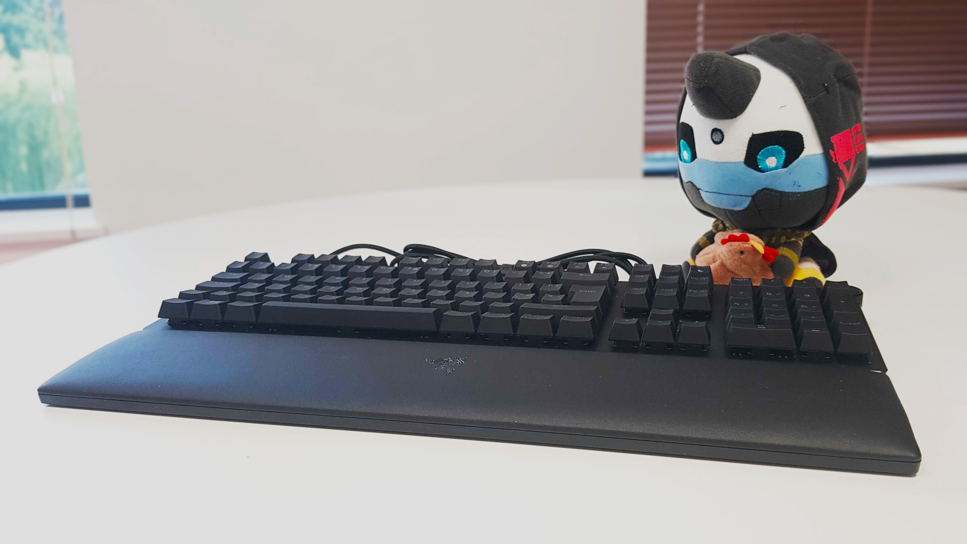 The Razer Huntsman 2 front view, with Cayde-6 plushie in shot