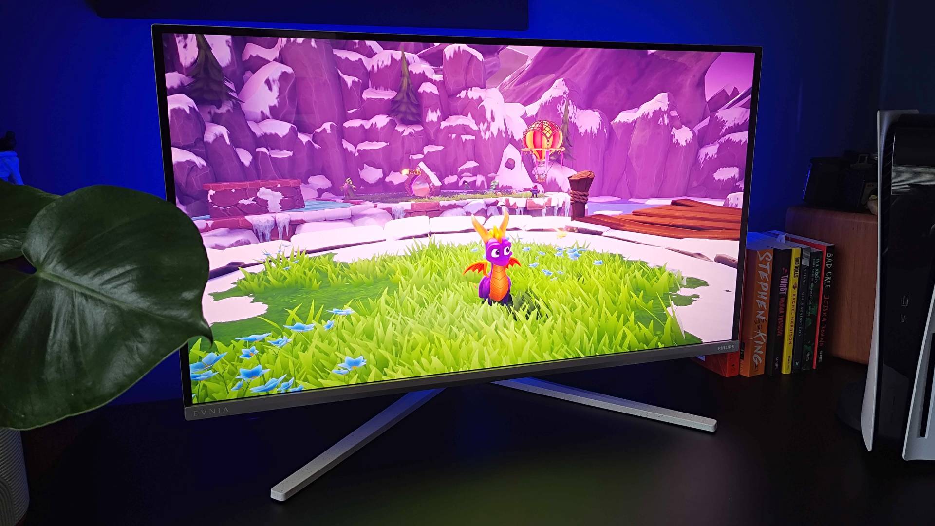 Philips Evnia 32M2N8900 monitor with Spyro the Dragon gameplay on screen.