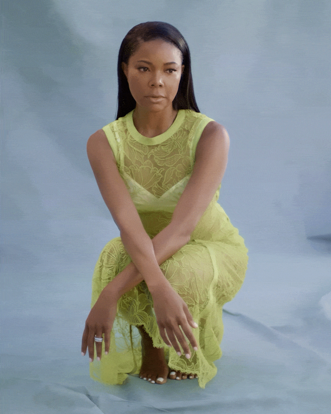 Gabrielle Union in a lime green dress posing for the camera