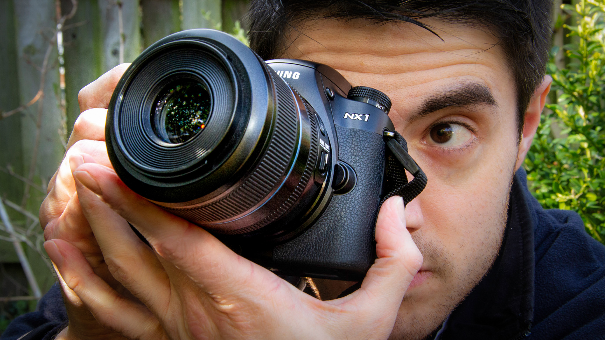 Peter Fenech holding Samsung NX1