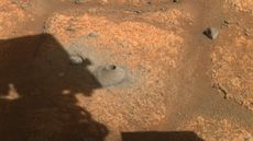 This image taken by one the hazard cameras aboard NASA&rsquo;s Perseverance rover on Aug. 6, 2021, shows the hole drilled in what the rover science team calls a &ldquo;paver rock&rdquo; in preparation for the mission&rsquo;s first attempt to collect a sample from Mars.