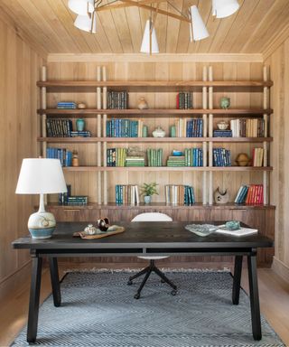 Wooden shelves and black office table