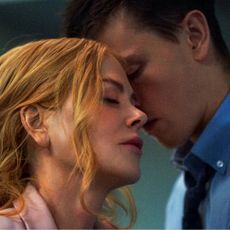 nicole kidman and harris dickinson embrace in an office in a still from the movie babygirl