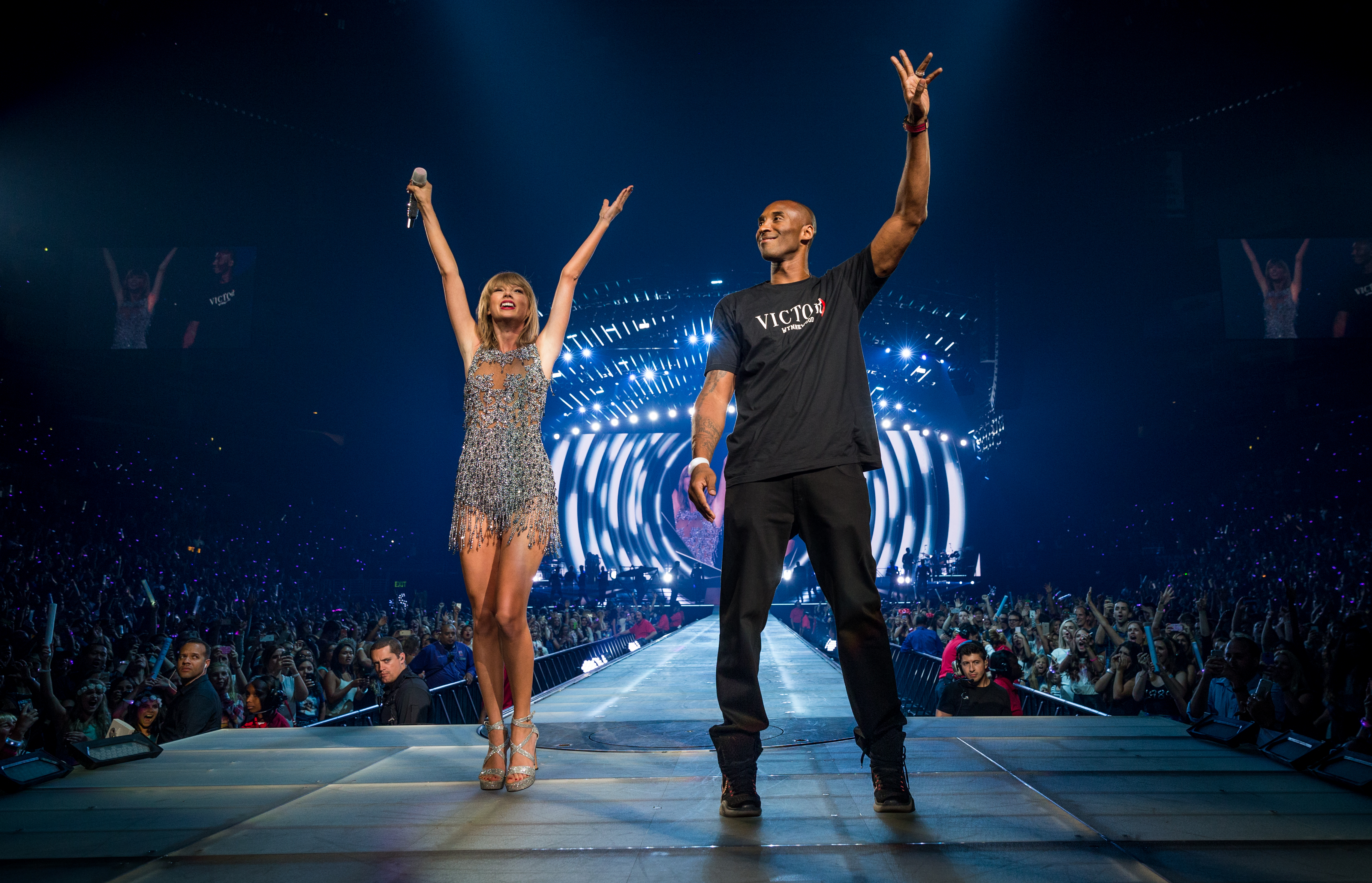 Singer-songwriter Taylor Swift (L) and NBA player Kobe Bryant onstage during The 1989 World Tour Live In Los Angeles at Staples Center on August 21, 2015 in Los Angeles, California